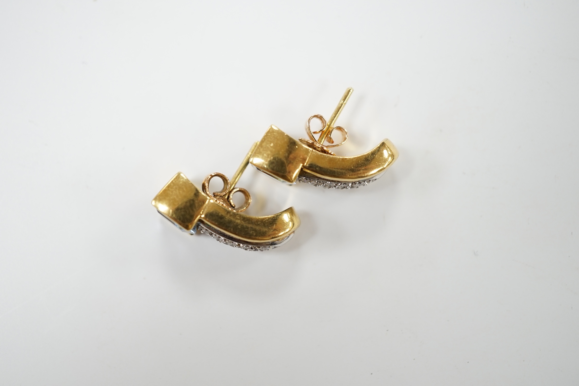 A modern pair of yellow metal and single stone fancy cut aquamarine and diamond chip cluster set earrings, 17mm, gross weight 10.6 rams. Condition - good